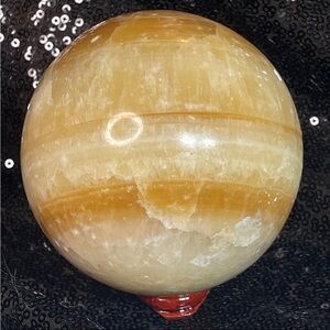 Orange calcite crystal sphere